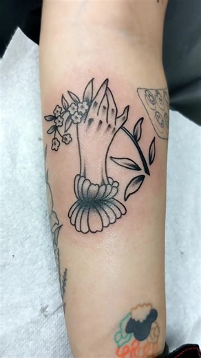 Hand Holding Flowers Tattoo Designs
