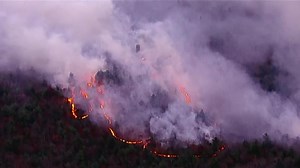 Fire crews battle large brush fire in Lynn