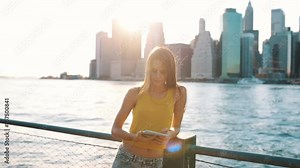 Young Beautiful Woman Using a Digital Tablet in New York City US