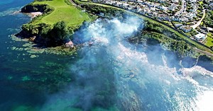 Drone footage shows smoke billowing across seafront after fire