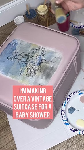 Blending out decoupage paper on a vintage suitcase makeover #dixiebellepaint #decoupagequeen #decoupage #blended #babyshowerideas | Simply Made Unique by Jill