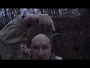 Setting a Leg Hold Trap on a Groundhog Hole