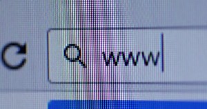 WWW written in search bar with cursor and magnifier symbol