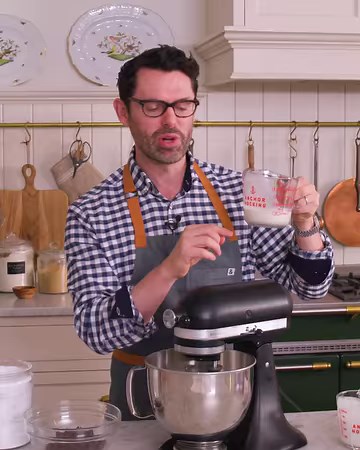 Made with simple kitchen staples, this chocolatey Swiss Roll recipe looks impressive but is easy to make from scratch. Filled with a homemade whipped cream and coated in a chocolate ganache, this dessert is rich, creamy, and flavorful. | Preppy Kitchen