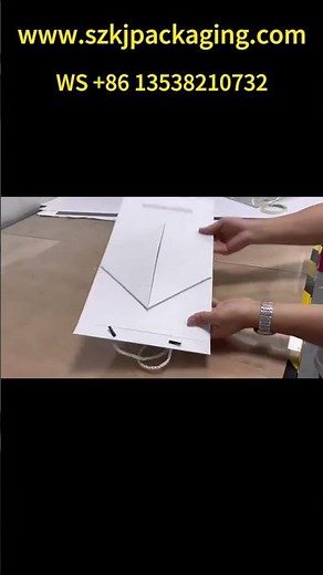 Trapezoidal foldable gift box with handle, flat for easy transport, saving space and shipping costs.