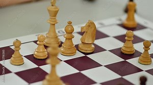 Close-up of a Hand Moving a Chess Piece on the Board. Chess Tournament, Competition, Play, Chessboard