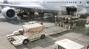 August 12, 2023 - Frankfurt am Main, Germany. Cargo aircraft loading. Workers work on airplane. Airport equipment for load. Working process. High quality 4k footage.