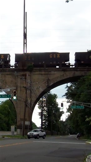 57 reactions | A loaded CSX coal train soars above NJ Route 29 at Ewing, New Jersey as it starts across the bridge spanning the Delaware River into Yardley, Pennsylvania. Filmed in June of 2018. ➡️ Follow @trainiacproductions for more original train content! #trainiac #railfan #trainspotting #trains #railways #coal #coaltrain #csx #fyp #railroad #train #newjersey | Trainiac Productions | Facebook
