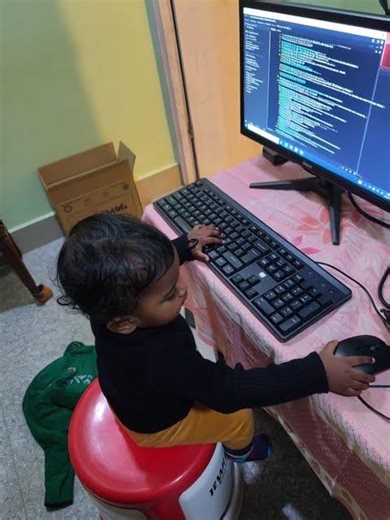 kid playing with a computer