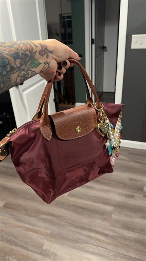 My @Longchamp #BOTW ❤️ I did punch holes to attach a crossbody strap. 😭 I might as well take advantage and use some of my many #bagcharms 🥰 #bagtok #pursetok #fyp