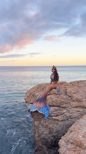 Mermaid on a sea cliff 🌊 wearing Sunseeker from Finfolk Productions x Merbella Studios Inc. releasing July 20th #fantastycreature #professionalmermaid #mermaidtail #fantasycostume #folklore #mermaidcore #mermaid #merbellastudios | Mermaid Sirenity