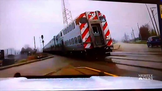 Video shows scary close-call between train and police vehicle
