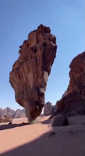 An inselberg geological formation located in a desert in Saudi Arabia