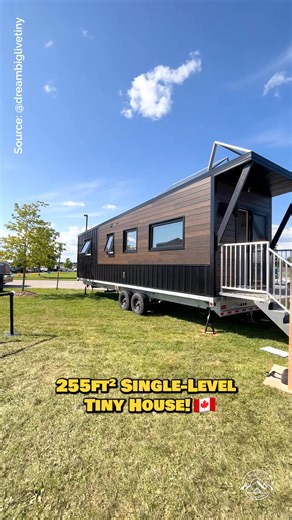 Welcome to the 30' "Nomad" tiny house on wheels by Canadian-based Minimaliste! This is their single-level towable tiny home that would make a great home on the road! Inside, there is a spacious living area with a couch & TV, a linear kitchen with apartment-size appliances, a dining booth that converts into a guest bed, a full bathroom with a small tub, & a private main-level bedroom with built-in storage! For more information on this model, please reach out to Minimaliste! #tinyhouse #tinyhome #