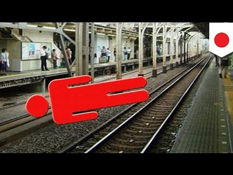 Train runs over Japanese office worker but no one notices