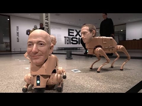 Watch: Robot dogs with Elon Musk and Bezos' faces are excreting AI art at a Berlin museum