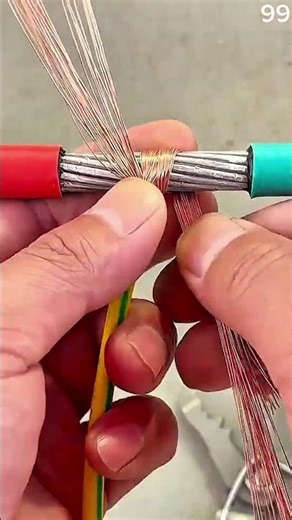 Copper strands wrapped with thinner wire, connection secured,