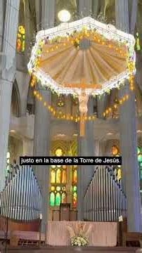 What do the initials in the central mosaic of the Sagrada Família mean?