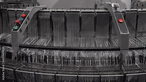 Production of polypropylene yarn for making bags. plastic polypropylene flat yarn bobbins loaded on circular weaving loom machine