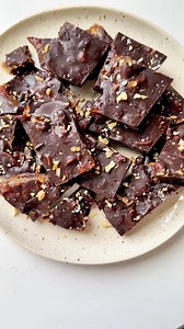 This viral date bark recipe combines medjool dates with peanut butter, chocolate and peanuts. It tastes like a Snickers bar and is the perfect healthy treat to keep stocked in your freezer. Vegan gluten-free. https://www.eatingbirdfood.com/date-bark/ | Eating Bird Food