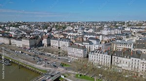 Pont Anne de Bretagne bridge with Notre Dame de Bon Port church in background, Nantes cityscape, France. Aerial forward and sky for copy space