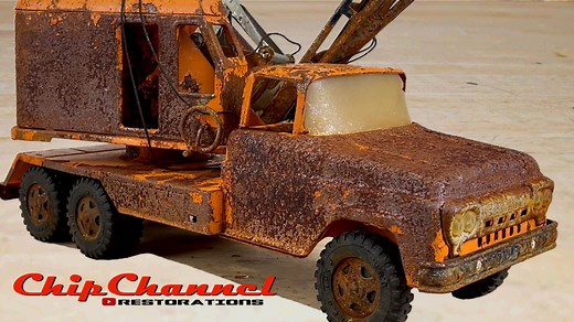 I purchased this 1961 Tonka State Highway Department Mobile Clam Crane Truck from a local antique store about a half hour from where I live. It was in terrible shape and overall desperately needed restoration. Everything was there minus the clam release that goes on the very top of the boom, which I fabricated on my CNC mill. The entire truck was covered in rust, flaking paint, and corrosion. The windshield was broken, the crane rope was all tangled up and weathered, one of the two out riggers w