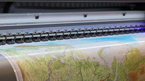 Premium stock video - Modern digital large format uv printer. printing production technologies. uv pinning is the process of applying a dose of low intensity ultraviolet light to a uv curable ink