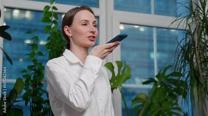 Voice note, chatting or talking of a woman on the phone at work in the office. Businesswoman talking on her speaker sending a voicemail or audio message.