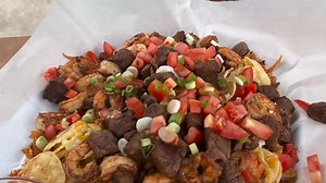 Transform your Weber Grill into a griddle with our Rust-Resistant Griddle Inserts! @meatkingz puts it to work with these fully loaded nachos topped with steak and shrimp. 🥩🦐 | Weber Grills Canada