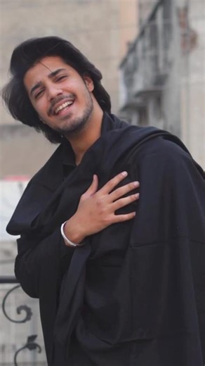 Elegant Cloak Fashion on a Balcony