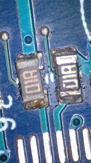 What a damaged SMD resistor looks like under the lens #pcb #electronics #repair