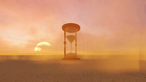 Hourglass in the middle of a sand desert - Free Stock Video