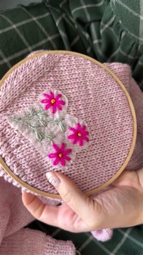 Meredith on Instagram: "Trying some embroidery on a sweater I knit for my friend’s daughter, using the book Embroidery on Knits, kindly gifted to me by @laine_magazine I traced a couple of designs to see what would fit best, and kept it on the simple side since it’s for a child. I like an asymmetrical design and made the flowers bright pink to really stand out from the soft knit of the sweater. All the yarns are tonals from @coatesandcofiber. Judit’s book is a wonderful guide, and I can’t wait t