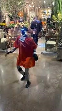 Humanoid Robot Shows Off Dance Moves at World Market Center