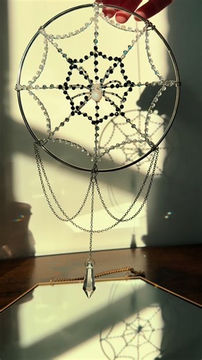 Just admiring the sparkles this spider and web suncatcher put on my wall. This was a giveaway piece that will be going to a loving home soon. 🥰🕷️🕸️✨ #handmade #suncatcher #whimsical #whimsicaldecor #spiderdecor