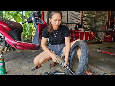 Girl repairing motorcycles in Vietnam