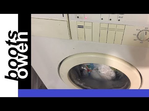 Washing machine full of water with blocked filter and stuck drain plug