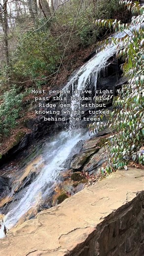 Tucked quietly off milepost 272 on the Blue Ridge Parkway, Cascade Falls is one of those places that surprises you with how much beauty fits into less than a mile of trail. 🌲 The hike — a gentle 0.8-mile loop through rhododendron, ferns, and towering hardwoods — leads to two wooden overlooks where Falls Creek spills over ancient rock. The waterfall itself drops more than 250 feet, but from the trail, you only see the top 20 — the rest disappears into forest and stone, hidden from view. 💧 It’s 