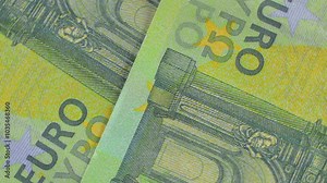 100 Euro Bills, Rotating Money Background - Top View. Euro Money Currency. Green Paper Money. Hundred Euro Banknotes. Business, Finances, Cash and Money Saving Concept - Slow Rotation Left