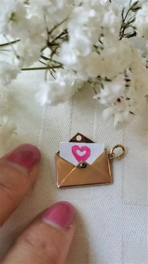 A gorgeous envelope charm for sale!!! What would you put in it? 🌼 a true antique sentimental jewel... . Antique 9k gold mechanical Envelope charm with a gem ruby button!!! I just get amazed by the ingenuity of the past craftsmanship...There's enough space inside to slide a note or put dried flowers or anything a little memento Well deserved old condition It opens and closes nicely What a sweet gift . These envelope charms are getting so hard to find now and highly coveted always $655 DM for pur