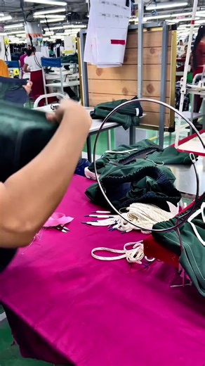 Manual Pants Stringing Process in Clothing Factory