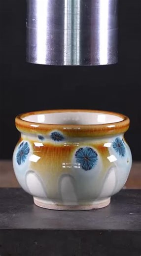 Nic Davis on Instagram: "Watch as a beautiful handmade ceramic soup crock with stunning crystal glaze meets the hydraulic press. The colorful crystals frozen in the glaze shimmer before the rim chips, fractures spread, and the whole thing splits into heavy pieces with a satisfying glaze seep."