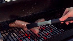 Putting Sausages On Grill Cook Them : vidéo de stock (100 % libre de droit) 1030557803 | Shutterstock