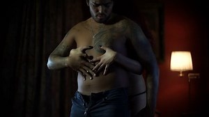 A couple in a intimal moment. Man and woman kissing and caress with passion