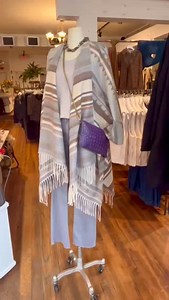✨ This multicolored Ruana with a striped and geometric pattern is a must have! We love the shades of brown, beige, and grey and the long fringe finishes off this perfect piece! 👗 Tank underneath is a new fabric, super soft, body flattering and an incredible layering piece. ✨ One of this seasons must have denim colors! These grey, straight-leg, scissored bottoms are on trend and you need them. 💥 To complete this fabulous outfit we are gushing over our newest hand crafted crossbody/clutch in a b