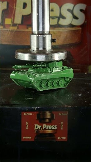Battle tank crushed under hydraulic press