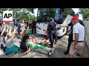 Protesters in Australia block bus believed to be carrying Iran women's soccer team