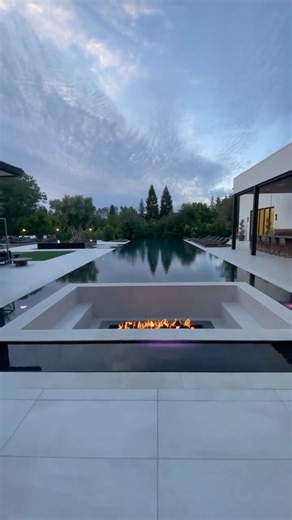 FOXTERRA Design | Luxury Landscape & Pool Design on Instagram: "A 100-foot pool in a million-dollar+ backyard isn’t about excess — it’s about scale, proportion, and designing a space that feels as expansive as the property itself. This pool anchors the entire yard, creating long sightlines, intentional zones, and a resort-level experience that works for both everyday living and large gatherings. When the design is done right, a feature like this doesn’t overpower the space — it defines it. This