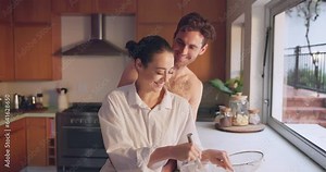 Bake, love or happy couple kiss in kitchen for romance, care or bonding together with an intimate connection. Man, woman and romantic people hug in the morning at home cooking breakfast with smile
