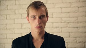 Calm man staring into the camera - Free Stock Video